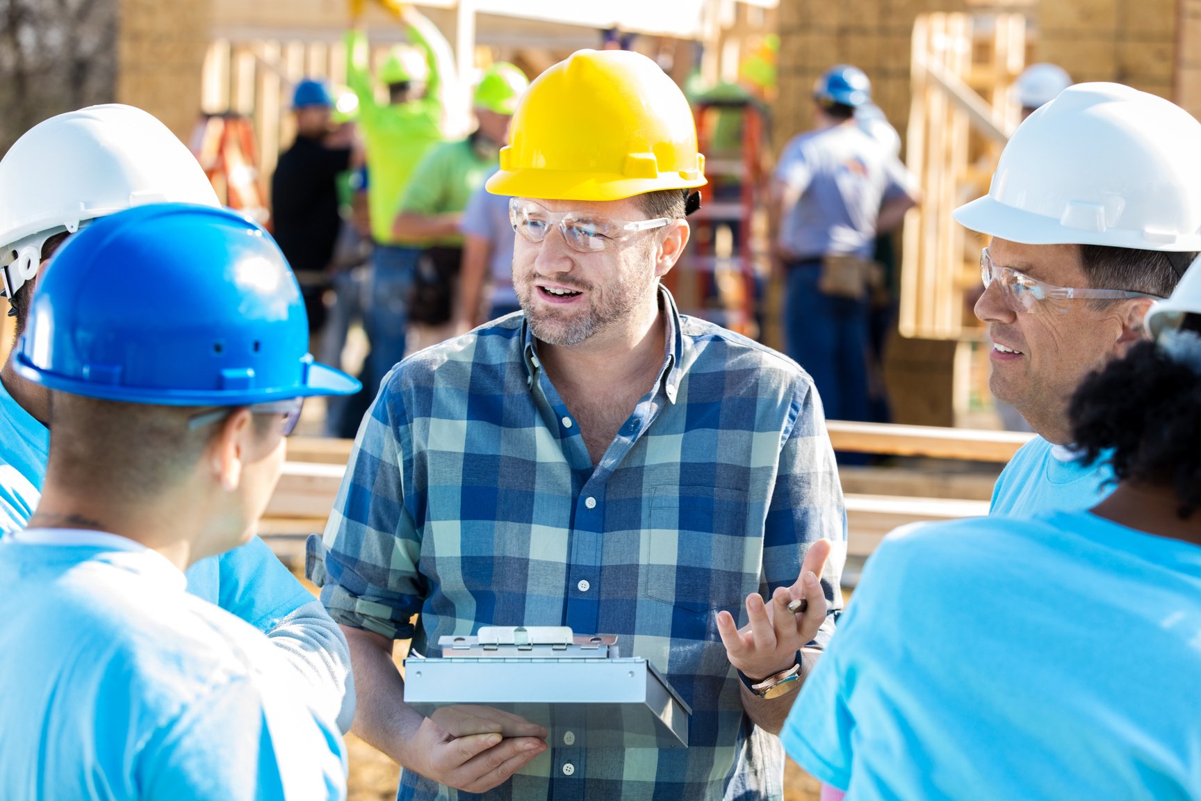 Construction manager with construction workers